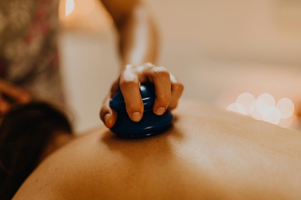 Close-up of cupping therapy on a person's back, focusing on relaxation and wellness.